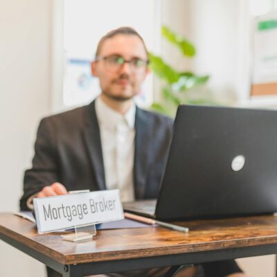 A Mortgage Broker Sitting Behind a Desk